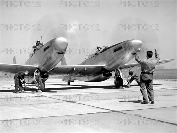 Pilot William Swann, right cockpit, prepares the North American XF-82 Twin Mustang for flight at the National Advisory Committee for Aeronautics (NACA) Lewis Flight Propulsion Laboratory.