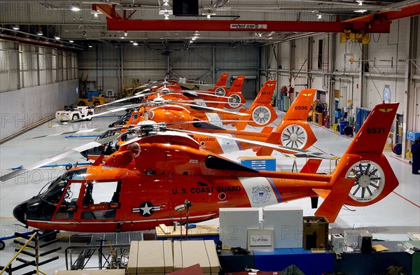 TRAVERSE CITY, Mich. (Jan. 21, 2004) All five Coast Guard Air Station Traverse City HH-65 Dolphin helicopters sit ready in the hanger in Northern Michigan.