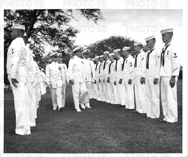 Air Station Barbers Point, Hawaii Original photo caption: 'Rea Admiral S. H. Evans, Commander of the 14th Coast Guard District, inspects personnel attached to the Coast Guard Air Detachment, Barbers Point, on Thursday November 5, 1959.