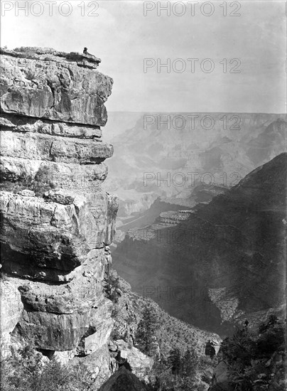 Ca. early 1900s - Man relaxing on edge of Grand Canyon