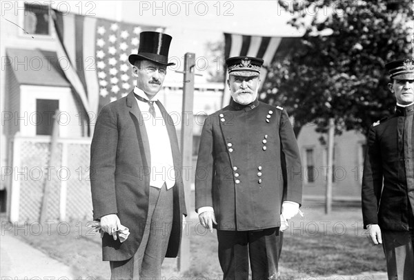 Photo shows General Frederick Dent Grant, commanding officer on Governors Island, with Secretary of War Henry I. Stimson, probably on the occasion of the annual lawn party sponsored by the Army Relief Society ca .1911