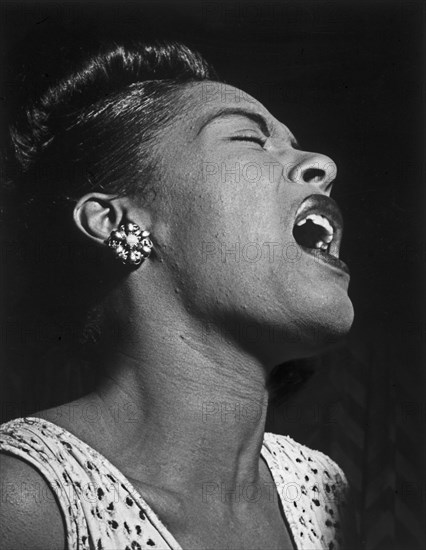 Billie Holiday at the Downbeat club, a jazz club in New York City. 1947