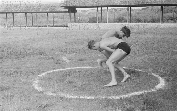 Young soldiers wrestling in Bandoeng, Indonesia, Java, Dutch East Indies ca. 1947