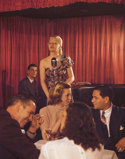 Woman signing at a jazz night club ca. 1948