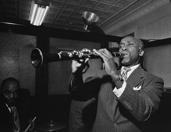 Portrait of Fess Williams and Freddie Moore, William P. Gottlieb's office party, ca. 1948