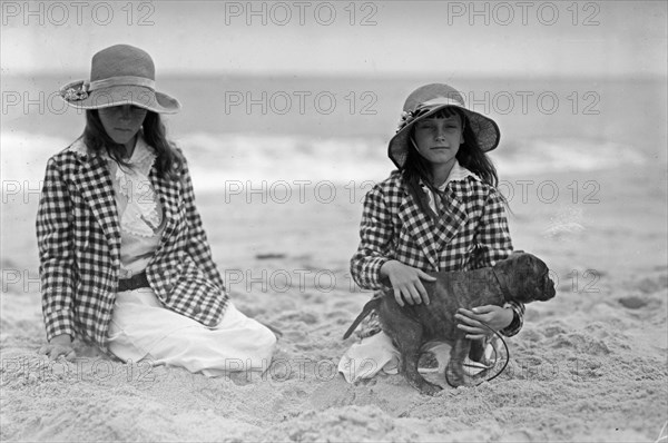 Jean and Charlotte Potter (young girls on a beach with a dog) ca. 1910-1915