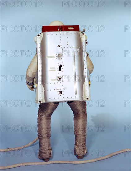 (May 1966) Rear view of the Astronaut Maneuvering Unit (AMU), worn by test subject Fred Spross, Crew Systems Division. The Gemini spacesuit, backpack and chest pack comprise the AMU, a system which is essentially a miniature manned spacecraft.