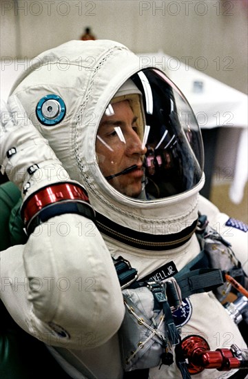 Astronaut James A. Lovell Jr., pilot of the Gemini-7 spaceflight, relaxes in the suiting up trailer at Launch Complex 16, during the Gemini-7 prelaunch countdown