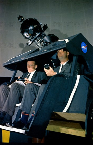 (7 May 1965) Astronauts James A. McDivitt (right) and Edward H. White II are shown at the Morehead Planetarium in North Carolina, checking out celestial navigation equipment as part of their training for the Gemini-Titan 4 mission.