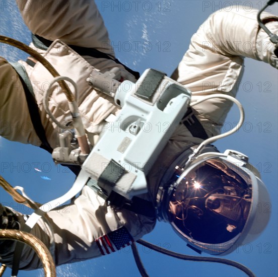 Astronaut Edward H. White II, pilot of the Gemini IV four-day Earth-orbital mission, floats in the zero gravity of space outside the Gemini IV spacecraft. (June 1965)