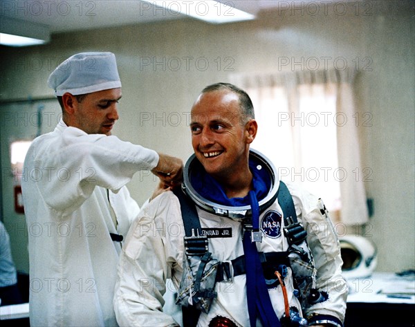 (12 July 1965) Astronaut Charles Conrad Jr. receives assistance with his pressure suit during suiting up and ingress test activity at Pad 16, Cape Kennedy, Florida in preparation for Gemini-5 spaceflight
