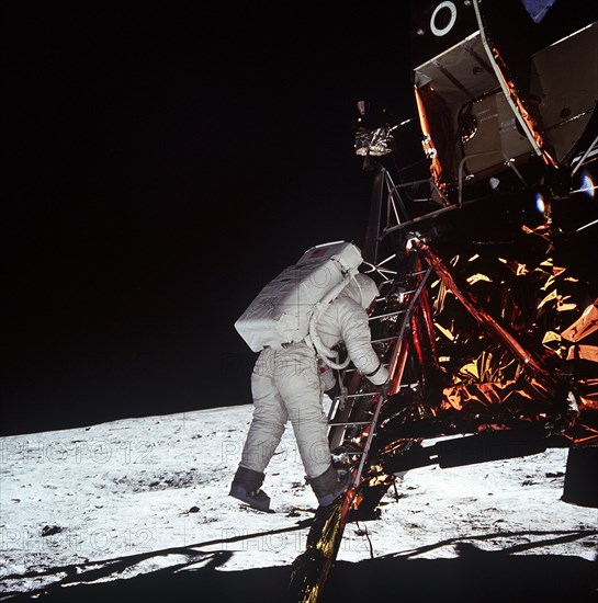 (20 July 1969) Astronaut Edwin E. Aldrin Jr., lunar module pilot, descends the steps of the Lunar Module (LM) ladder as he prepares to walk on the moon. He had just egressed the LM.