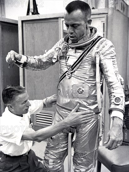 Astronaut Alan Shepard fitted with space suit prior to the first manned suborbital flight. Freedom 7, carrying Astronaut Alan Shepard, boosted by the Mercury-Redstone launch vehicle, lifted off on May 5, 1961.