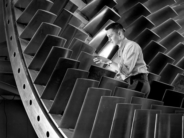 NACA Engineer Examines Wind Tunnel Compressor Blades ca. 1955