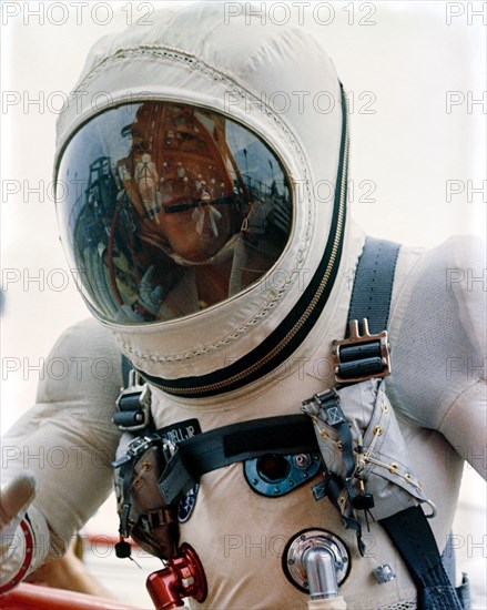 (4 Dec. 1965) Astronaut James A. Lovell Jr., pilot of the Gemini-7 spacecraft, walks up the ramp at Pad 19 during the Gemini-7 prelaunch countdown.