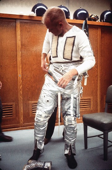 (20 Feb. 1962) Astronaut John H. Glenn Jr. dons spacesuit during preflight operations at Cape Canaveral, Feb. 20, 1962, the day he flew his Mercury-Atlas 6 spacecraft, Friendship 7, into orbital flight around Earth.