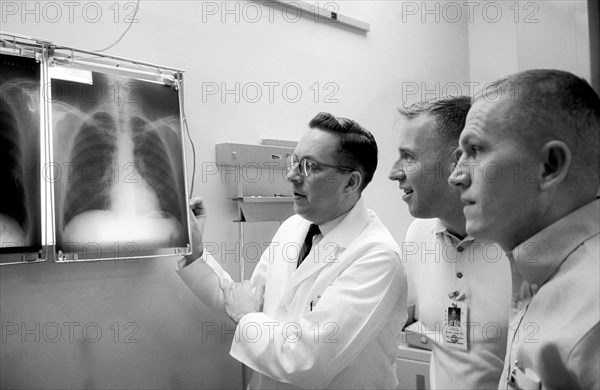 Dr. Charles A. Berry (left), chief of the Manned Spacecraft Center (MSC) Medical Programs, and astronauts James A. Lovell Jr. (center), Gemini-7 pilot, and Frank Borman, Gemini-7 command pilot