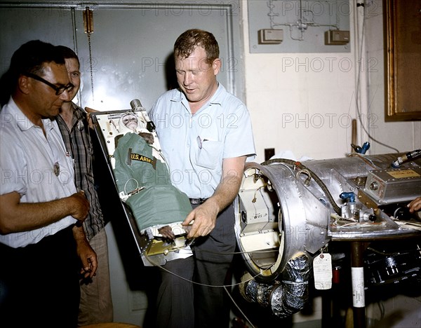 A squirrel monkey, Able, is being ready for placement into a capsule for a preflight test of Jupiter, AM-18 mission.