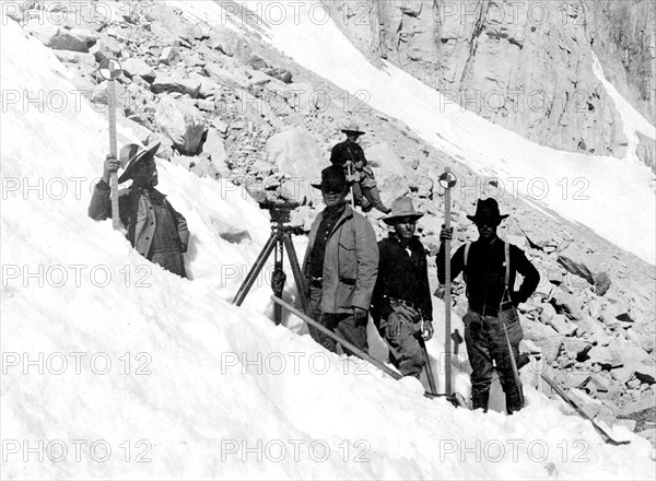 In this photo, taken in August 1905, we see a USGS topographic leveling party, headed by R.A. Farmer on the slopes of Mount Whitney, California