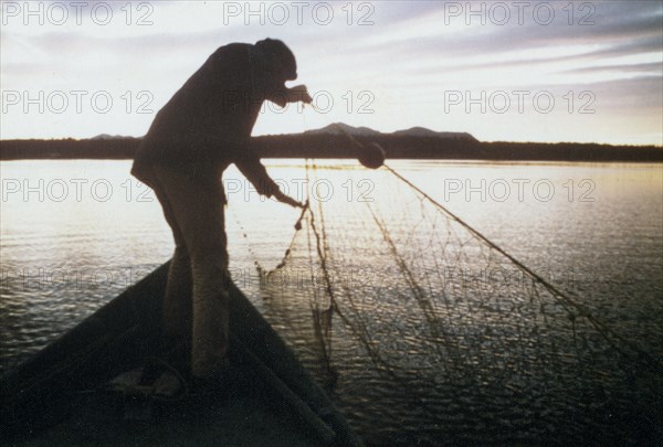 Fishing for whitefish along Kobuk River near the village of Ambler ca. 1973-1975