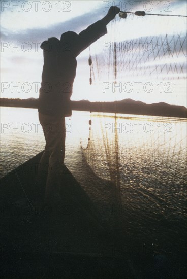 Fishing for whitefish along Kobuk River near the village of Ambler ca. 1973-1975