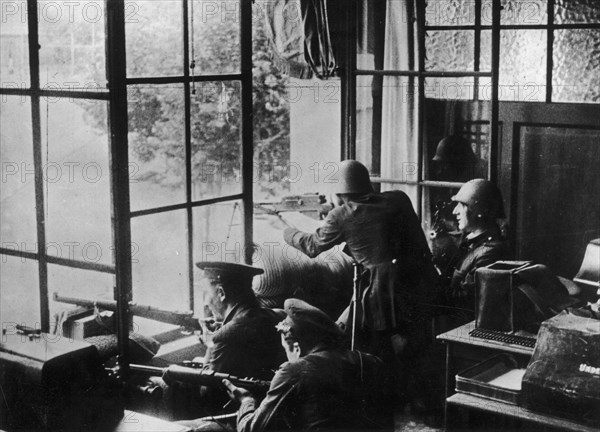 Spanish Civil War: Republican soldiers and Assault Guards during the July 1936 uprising in Barcelona, in the Telefónica building
