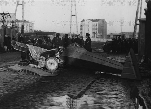 Soldiers or police looking over remains of an airplane crash in Poland ca. 1931