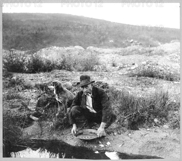 Miner panning gold 1916