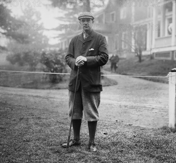 Findlay S. Douglass, with golf club, Baltusrol