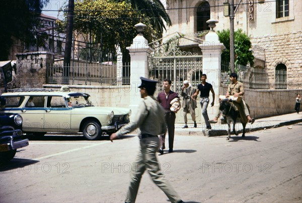 Israel April 1965: Young men crossing the street in this scene from Nazareth