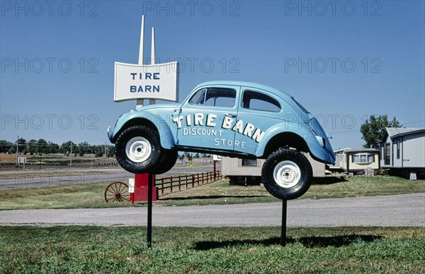 1980s United States -  Tire Barn sign, Route 50, Yankton, South Dakota 1987