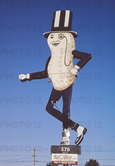 1980s United States -  Mr Peanut sign, Hair Affair sign, Route 6, Swansea, Massachusetts 1984