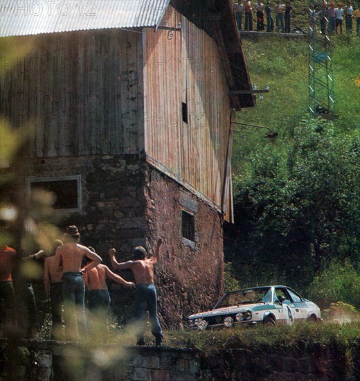 Italian rally driver Mauro Pregliasco and his co-driver Piero Sodano on a Lancia Beta Coupé sponsored Alitalia at the 1975 Rallye Eastern Alps ca. June 1975