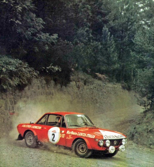 Italian rally driver Amilcare Ballestrieri and his co-driver Mario Bernacchini on a Lancia Fulvia 1.6 Coupé HF (Group 4) sponsored Marlboro at the 1972 Rallye Sanremo ca. October 1972