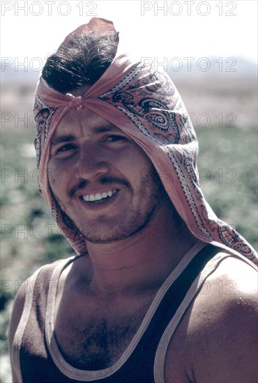 Mexican farm worker in the Imperial Valley. He carries a green card which permits him to work on U.S. farms, May 1972