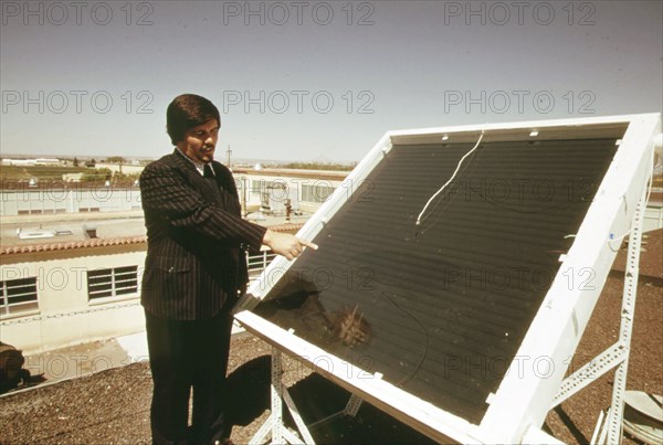 Dr. R.L. San Martin, New Mexico State University, Las Cruces shows a closed coil type solar heating panel