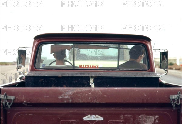 Rifle in pickup truck, 06 1973 Wyoming