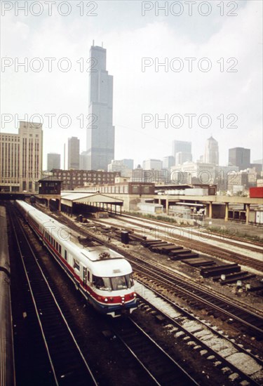 New Amtrak turboliner which now makes the passenger run between Chicago and St. Louis, Missouri, contrasts with the older smoking type engines which are now used less frequently than in the past, June 1974
