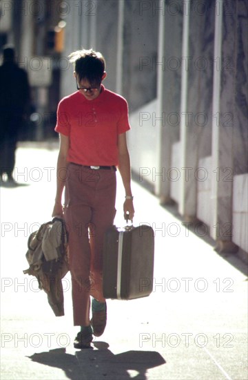 On a street in downtown Omaha, May 1973 young man lonely