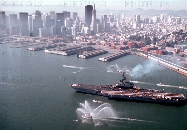 Harbor tug spraying water