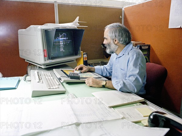 Engineer monitoring a printout