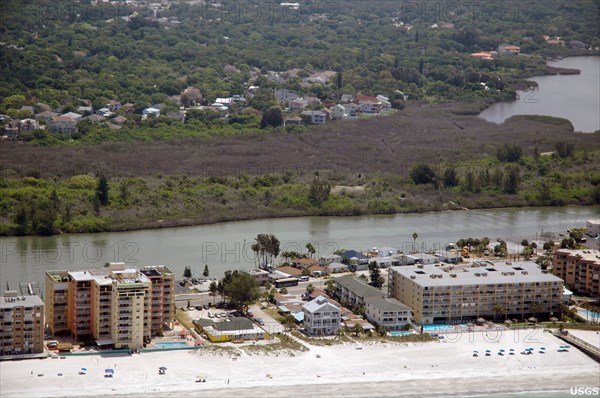 Florida's mangrove forests were hard hit by the uncommonly cold temperatures in January, 2010. Here, a dull brown swath of freeze-damaged mangroves cuts across the photograph, Pinellas County, FL -  ca. May 2010
