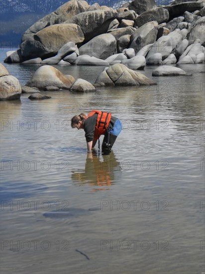 USGS worker collecting water samples at Sand Harbor, Lake Tahoe ca. 2010