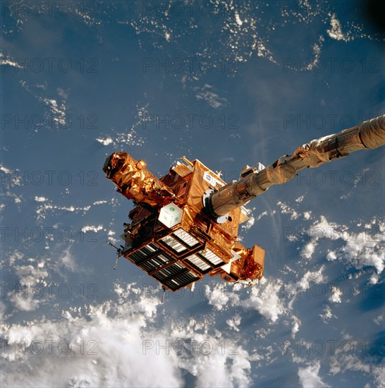 SPARTAN satellite on RMS arm prior to release