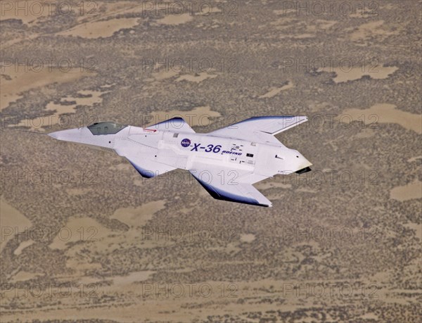 X-36 in Flight over Mojave Desert - The unusual lines of the X-36 technology demonstrator contrast sharply with the desert floor as the remotely piloted aircraft scoots across the California desert at low altitude during a research flight on October 30, 1