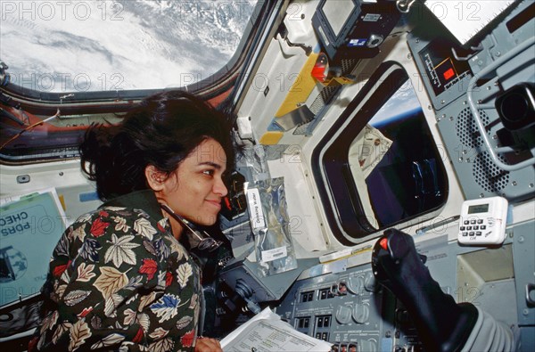 Kalpana Chawla directs the EVA from inside the flight deck