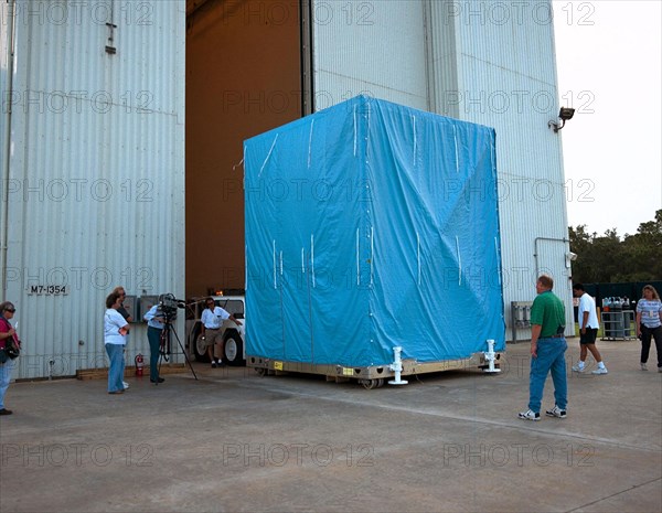 The cover on the Cassini Propulsion Module is installed, and the module is moved to the Payload Hazardous Servicing Facility ca. 1997