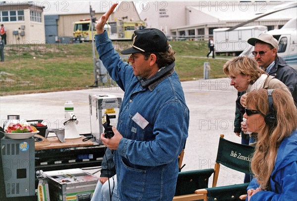 Robert Zemeckis, director/producer, and other Warner Bros. crew members oversee the filming of scenes for the movie "Contact" at Kennedy Space Center's Launch Complex 39 Press Site on January 30 ca. 1997
