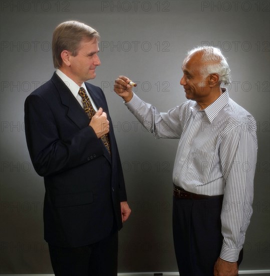 Dale Cruikshank and Bishun Khare with Ice Tholen Sample ca. 1997