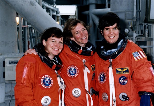 STS-83 Alternate Mission Specialist Catherine "Cady" Coleman, Pilot Susan L. Still and Payload Commander Janice Voss mug for the camera at the 195-foot level of Launch Pad 39A during Terminal Countdown Demonstration Test (TCDT) exercises ca. 1997